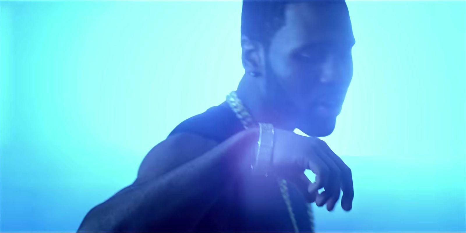 a man with a chain around his neck
