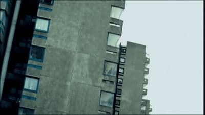 a tall building with lots of windows next to a tall building
