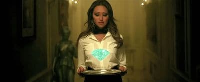 a woman holding a plate in a hallway