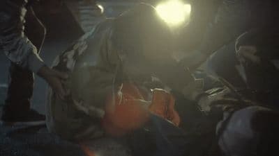 a man in a gas mask working on a piece of equipment