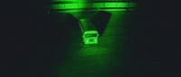 a bus driving through a tunnel in the dark