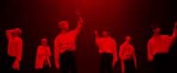 a group of young men standing on a stage