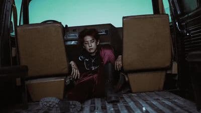 a man sitting in the back of a van