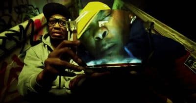 a man taking a picture of himself with a cell phone