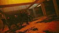 a group of people standing in a hallway