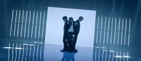 a couple of men standing next to each other
