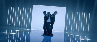 a couple of men standing next to each other