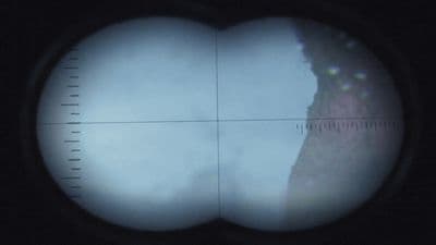 a view through a magnifying glass of a mountain