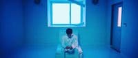 a man sitting in a chair in a room