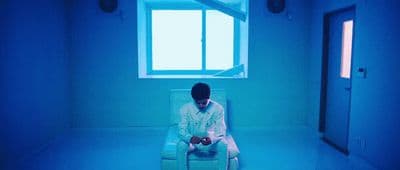 a man sitting in a chair in a room