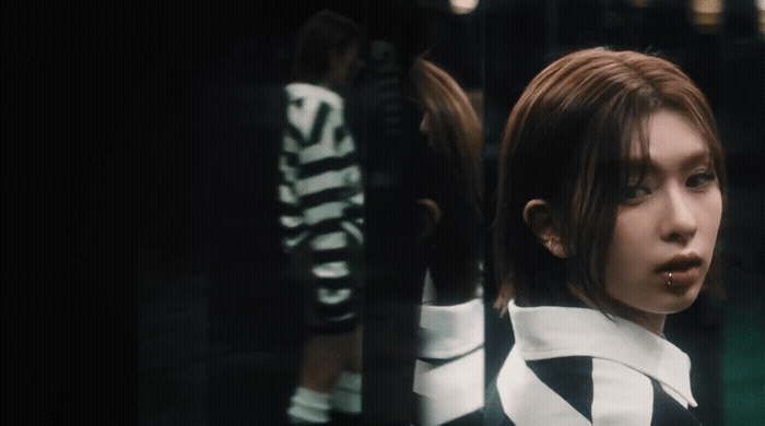 a woman in a black and white striped shirt