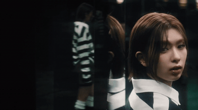 a woman in a black and white striped shirt