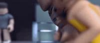 a blurry image of a man in a yellow bathing suit