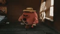 a stuffed animal with a hat on standing in front of a window