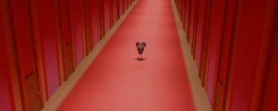 a person riding a bike down a long hallway