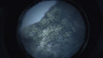 a view of a mountain through a magnifying glass