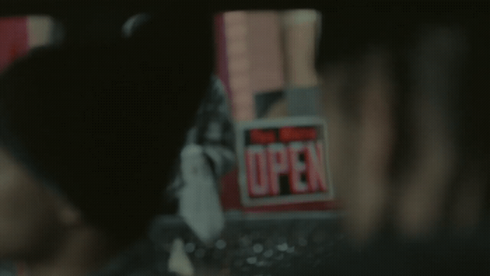 a blurry photo of a person holding a cell phone