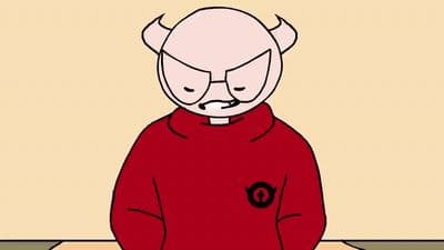 a man in a red shirt sitting on a table