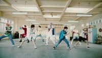 a group of people dancing in a room