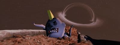 a cartoon character sitting on top of a pile of dirt