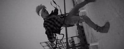 a man jumping up in the air with a skateboard