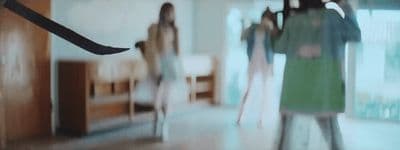 a blurry photo of a group of women in a room