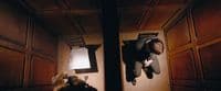 a person laying on the ground in a room