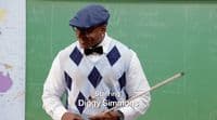 a man wearing a blue hat and bow tie