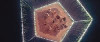an aerial view of a group of elephants in a field