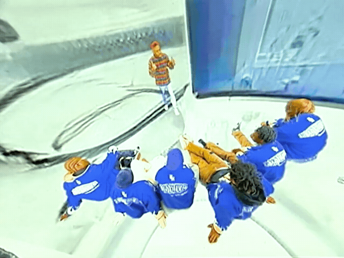a group of people riding on top of a snow covered ski slope