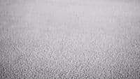 a black and white photo of a textured surface