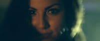 a close up of a woman's face with a blurry background
