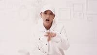 a person in a white jacket and hat