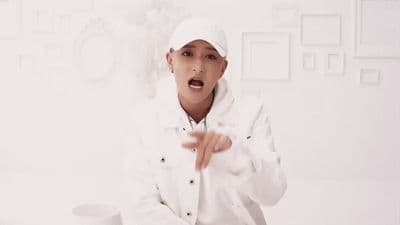 a person in a white jacket and hat
