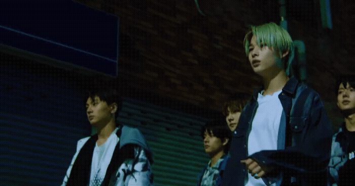 a group of young men standing next to each other
