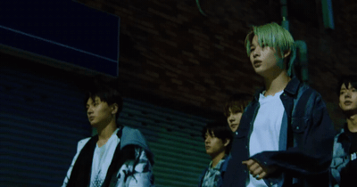 a group of young men standing next to each other