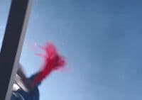 a blurry image of a person with red hair