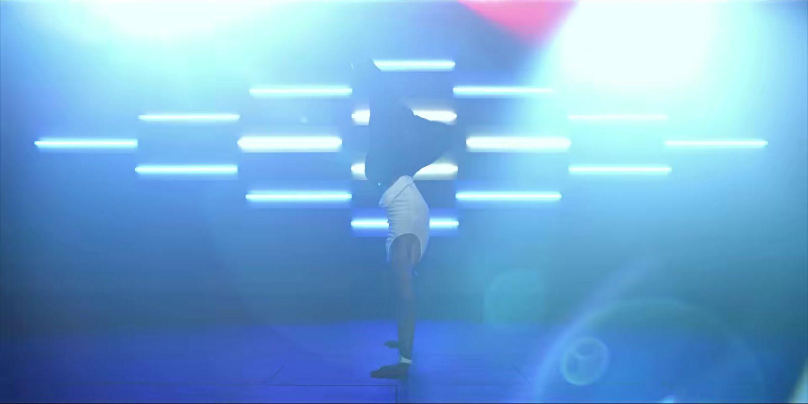 a person standing on a stage with a microphone
