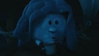 a close up of a stuffed animal under a blanket