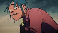 a person with blue hair and a pink shirt
