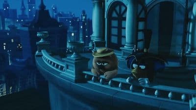 a couple of cartoon characters standing on top of a building