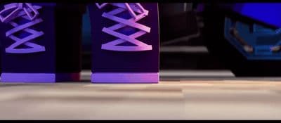 a close up of a pair of purple sneakers