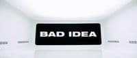 a bad idea sign in a white room