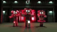 a couple of robots standing next to each other