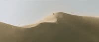 a person standing on top of a wave in the ocean