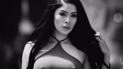 a black and white photo of a woman with long hair