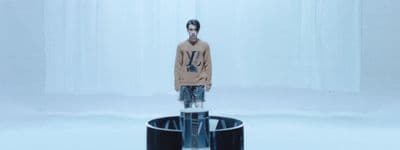 a man standing in front of a round object