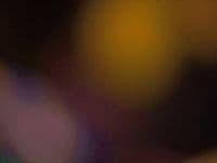 a blurry photo of a cell phone with a blurry background