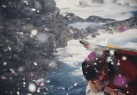 a couple of people that are standing in the snow