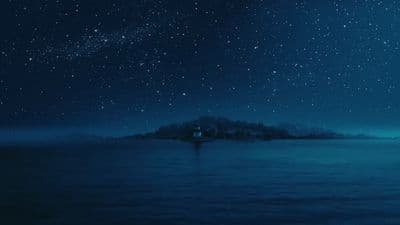 a night sky filled with stars and a small island in the middle of the ocean